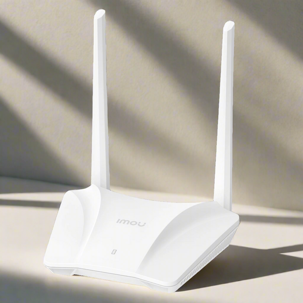 White router with antennas on a light background
